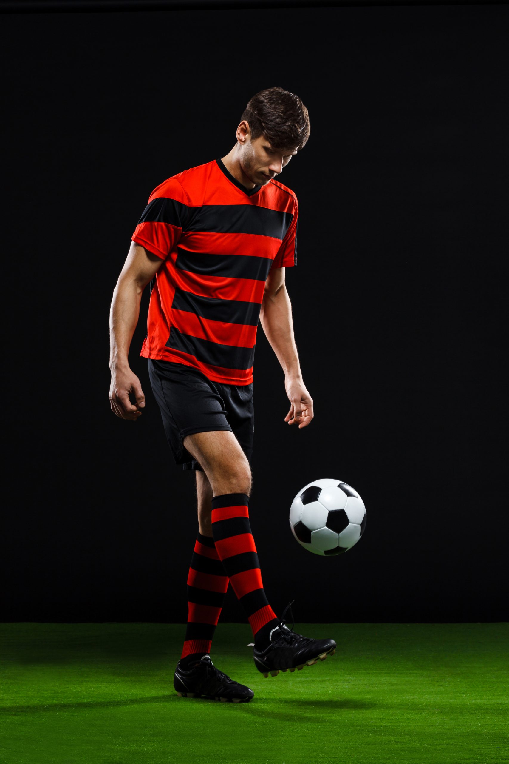 football player kicking ball